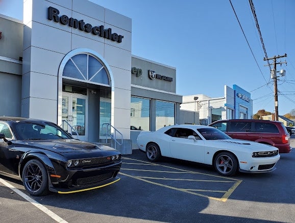 A vehicles are parked front of Rentschler CDJR showroom