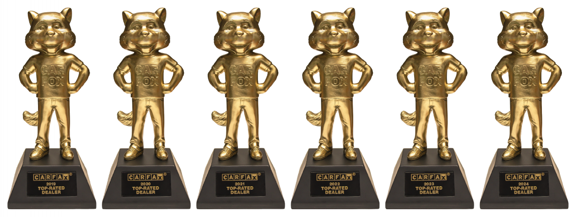 Six golden Carfax fox trophies, each for 'Top-Rated Dealer' from 2019 to 2024.